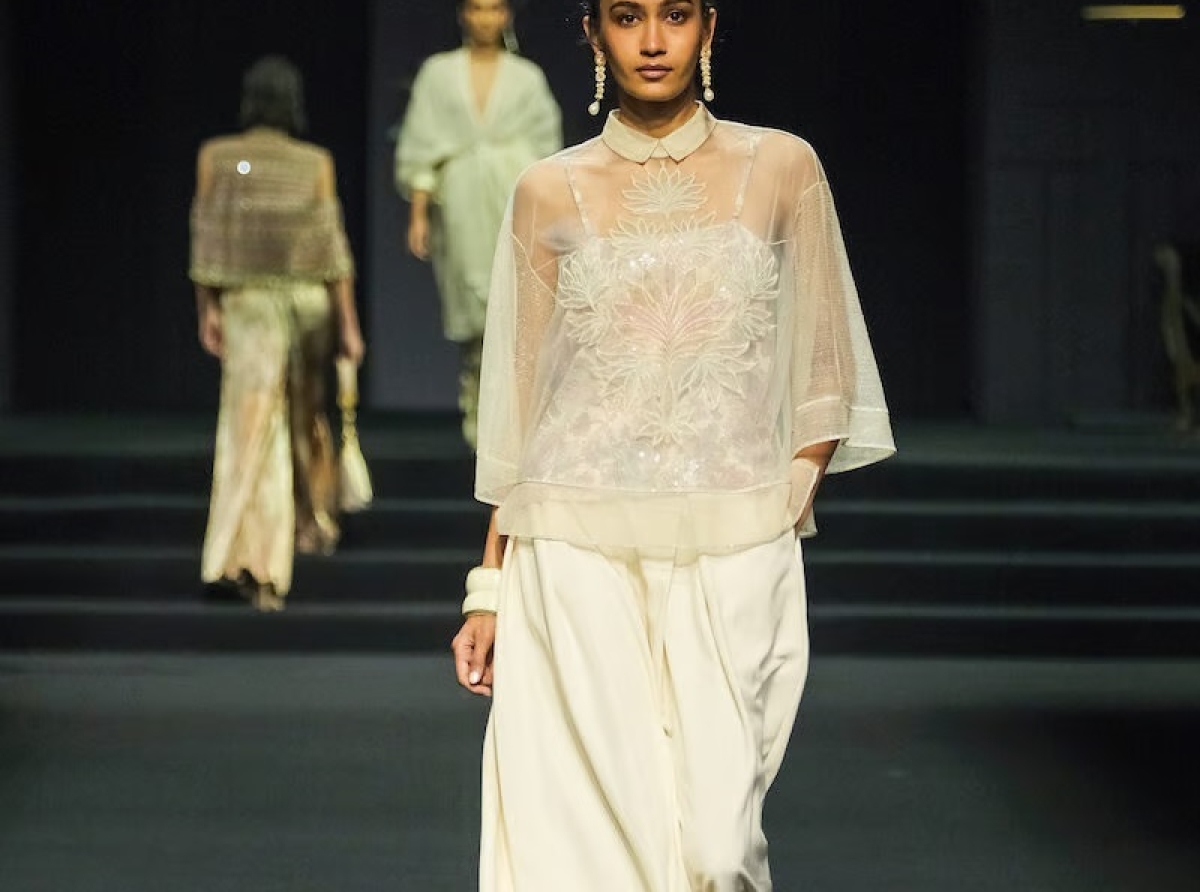 Tarun Tahiliani Brand Logo 2026.Tarun Tahiliani's brand OTT showcases multi-wear garments collection at ...